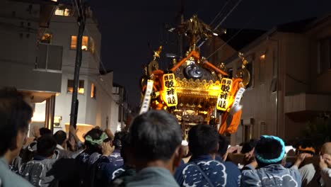 Tracking-shot-showing-crowd-of-japanese-people-celebrating-Sanja-Festival-in-Tokyo-during-night