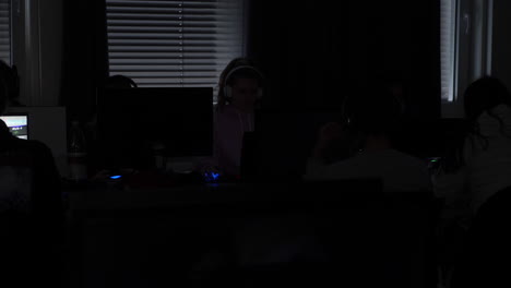 Static-shot,-of-a-people-playing-games,-in-the-dark-gaming-on-their-computers,-at-a-LAN-party,-in-south-Norway