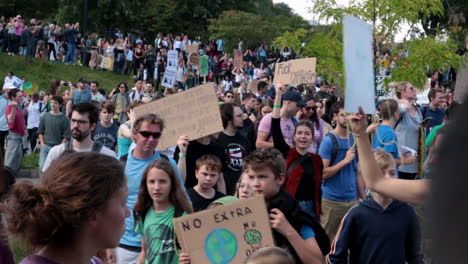 Environment-activists-gathering-and-holding-signs-during-Greta-Thunberg-speech-in-Montreal