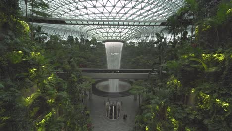 Wide-view-of-the-world's-tallest-indoor-waterfall-at-the-center-of-Jewel-Changi-Airport-in-Singapore-4k