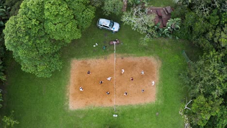 People-playing-volleyball-outside-aerial-top-view