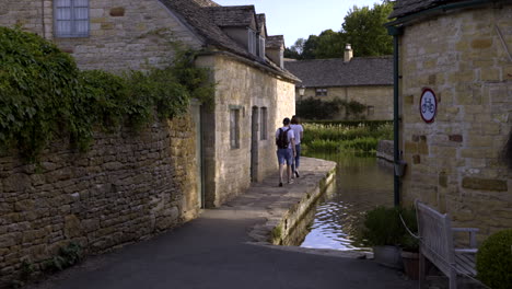 This-footage-shows-a-couple-walking-through-the-pathway-at-Old-Mill-Lower-Slaughter