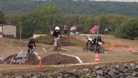 Slow-Motion-Of-Teenage-Boys-Racing-On-The-Track-During-BMX-Race-Event-In-New-York