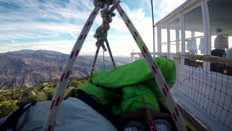 Basket-of-camping-supplies-being-lowered-by-a-basket-and-pulley-system-down-from-a-fire-lookout-tower