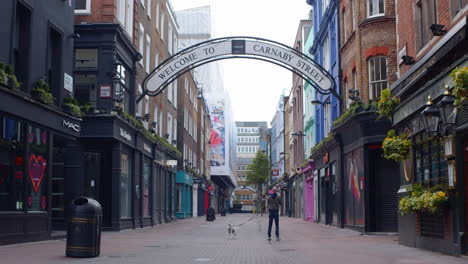 Carnaby-Street-Soho-in-Covid-pandemic-lockdown-with-single-person-in-shot,-London
