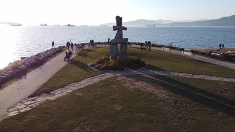 Aerial-still-of-Sunset-Beach-Inukshuk-First-Nations-sculpture-and-navigation-statue