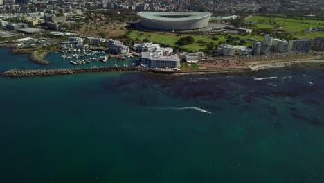 Aerial-reveal-of-Cape-Town-Stadium,-Resort,-Golf-Course
