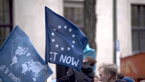 Slow-motion-of-flag-waving-at-environmental-demonstration-to-protect-the-planet