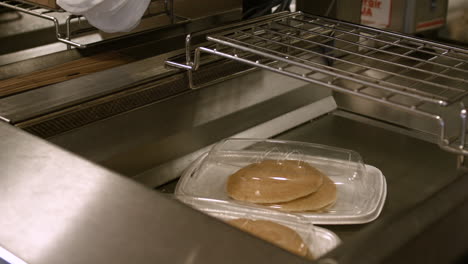 McDonald's-pancakes-are-placed-in-the-food-staging-area-awaiting-delivery-to-the-customer