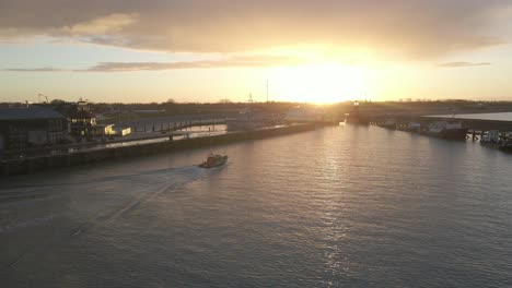 Spectacular-sunrise-at-quiet-Harlingen-harbor-with-one-coastguard-boat