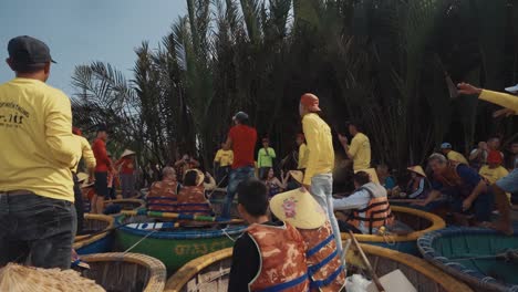 Group-of-Vietnamese-Adults-Dancing-Together-on-Basket-Boats