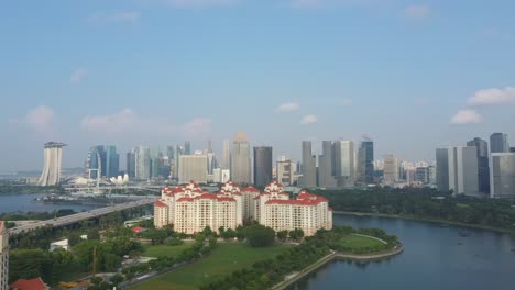 Aerial-drone-shot-of-Costa-Rhu-with-Singapore-skyline-backdrop