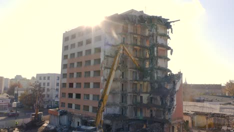 View-of-an-Excavator-demolishing-a-high-rise-apartment-in-the-city