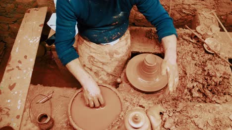 top-view-of-craftsman-working-in-his-pottery-workshop