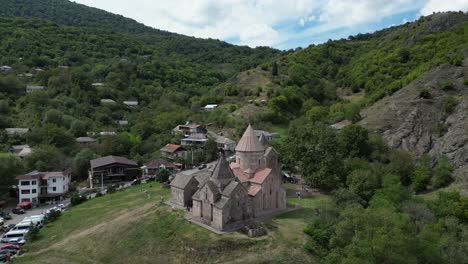 Low-aerial-retreats-from-stone-Goshavank-Monastery-in-Gosh,-Armenia