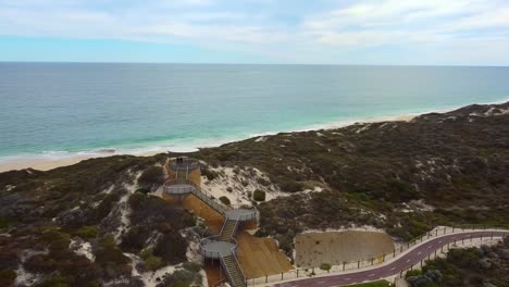 Aerial-orbit-of-coastal-lookout-tower-at-Amberton-Beach,-Perth