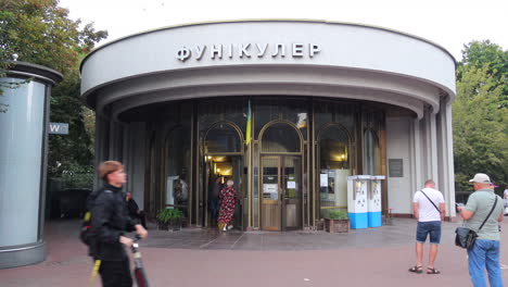 Funicular-railroad-main-entrance-in-Kyiv-city-Ukraine,-public-transport,-people-walking,-4K-shot