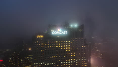 Aerial-view-around-the-Comcast-Building-,-misty-night-in-NYC