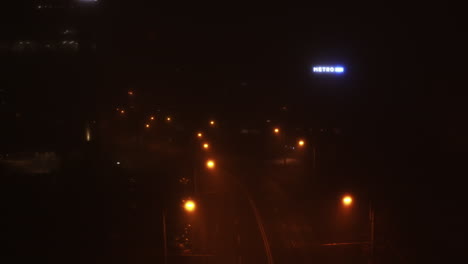Cinematic,-city-under-fog-aerial-drone-footage-of-Cluj-Napoca-city-at-night