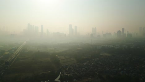 Mumbai-skyline-covered-in-smog,-extreme-air-pollution-India,-drone-flyover-aerial-establishment-shot