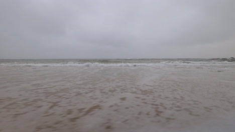 Cape-Paterson-Bay-Beach,-waves-coming-towards-camera,-moving-right-to-left,-Overcast-grey,-Australia-Victoria