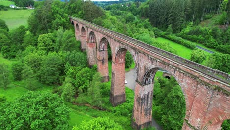 Aerial-view,-stone-arch-bridge-Himbächel-Viaduct,-Erbach,-Germany