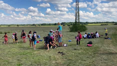 A-group-of-children-playing-in-a-meadow-on-a-sunny-day