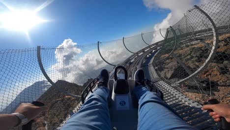 Jais-Sledder,-a-1,885-metre-toboggan-runs-that-winds-down-through-the-Hajar-Mountains,-officially-opened-to-the-public-on-Wednesday,-16-February-2022,-in-Ras-Al-Khaimah,-United-Arab-Emirates