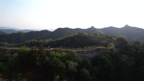 Couple-flies-a-drone-over-the-unrestored-Gubeikou-section-of-the-Great-Wall-before-sunset