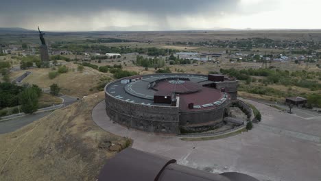 Aerial-orbits-Black-Fortress-on-hill-in-Gyumri-Armenia,-historic-fort