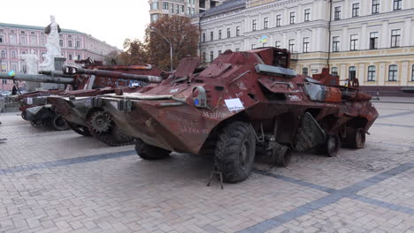 Mykhailivska-Square-filled-with-shelled-tanks-from-the-Russia-Ukraine-war-in-Kyiv-city-center,-burned-and-destroyed-war-vehicles,-4K-shot