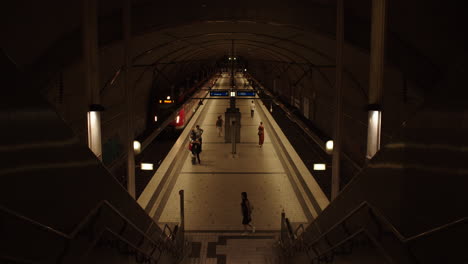 Few-people-in-underground-Frankfurt-metro-station-waiting-for-subway-train-to-arrive,-Germany,-covid-19-quarantine,-static