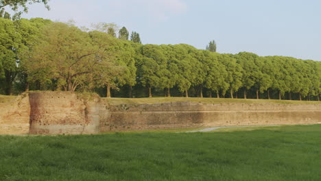 Wide-pan-right-landscape-shot-of-Ferrara's-ancient-city-walls