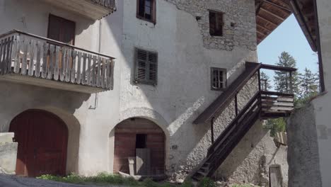 An-old,-rustic-farmhouse-built-out-of-stones-in-the-village-of-Entiklar---Niclara,-South-Tyrol,-Italy
