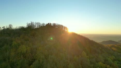 Castle-ruins-Löwenburg-on-the-hill-top-called-Löwenburg-in-the-Siebengebirge-with-an-amazing-sun-set-during-Autumn