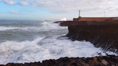 Waves-crash-on-the-shore-in-front-of-the-lighthouse-of-Rabat-in-Morocco