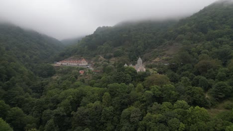 Haghartsin-Monastery-in-misty-mtn-valley-forest-near-Dilijan,-Armenia
