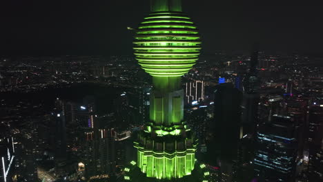 Aerial-view-around-the-green-top-of-the-Petronas-Twin-Towers,-in-Kuala-Lumpur