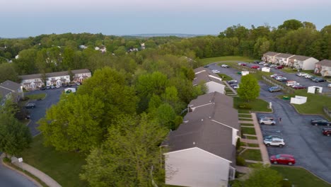 Sunset-over-residential-neighborhood-with-homes-and-winding-roads