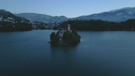 -Aerial-view-of-an-isolated-islet-with-a-church-in-the-middle-of-Lake-Bled