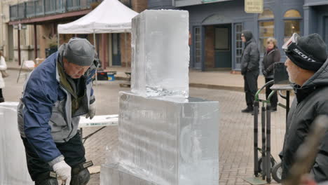 Static-slomo-shot-of-ice-sculptors-fusing-ice-blocks