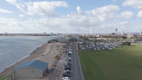 Flight-along-Southsea-seafront-to-Clarence-Pier-with-Old-Portsmouth,-harbour-and-Spinnaker-Tower-in-the-back-ground