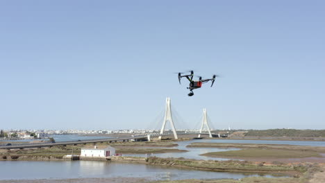 footage-of-drone-dji-inspire-during-a-test-flight-against-the-background-of-the-Portimao-Railway-Bridge,-in-the-Faro-District,-Portugal-on-November-10,-2021