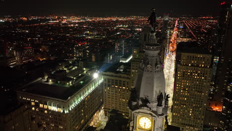 Aerial-orbit-of-City-Hall-statue-at-night