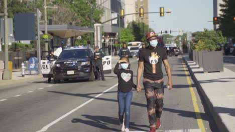Black-Civilian-With-Daughter-Walking-Away-From-Police