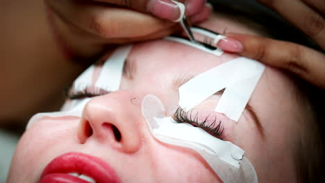 Closeup-on-face-of-caucasian-woman-getting-lash-extensions-beauty-treatment