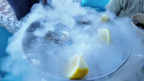 Fresh-oysters-on-a-bed-of-ice-with-lemon-slices,-ready-to-be-enjoyed