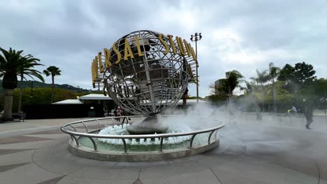 Universal-Studios-Theme-Park-globe-logo-in-Hollywood,-California-on-a-cloudy-day