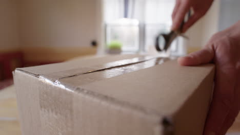 Scissors-used-to-open-a-parcel-received-from-an-online-order