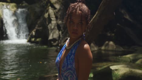 Enjoying-the-waterfall-and-river,-a-young-girl-in-a-bikini-visits-Trinidad